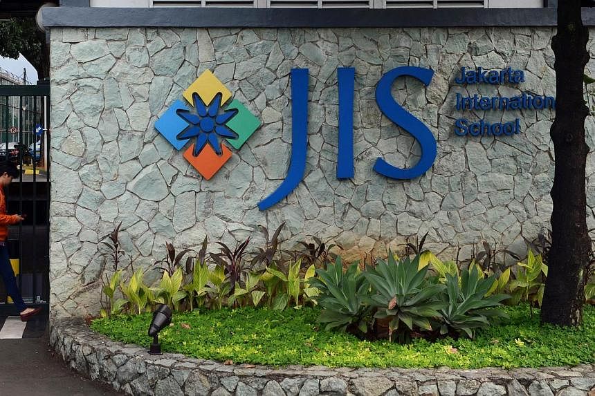 This file photo taken on April 21, 2014 shows the main entrance of the Jakarta International School in the Indonesian capital city of Jakarta. A Canadian teacher has been arrested in Indonesia for alleged child sex abuse, police said on July 15, 2014