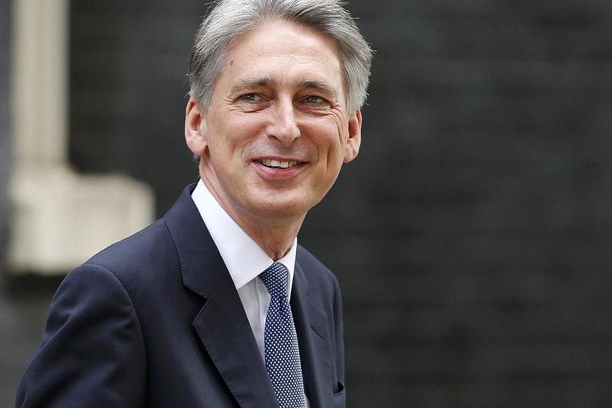 Britain's new Foreign Secretary Philip Hammond arrives at 10 Downing Street in central London,on July 15, 2015.&nbsp;Prime Minister David Cameron appointed Philip Hammond as foreign minister on Tuesday as he reshuffles his Cabinet ahead of the 2015 G