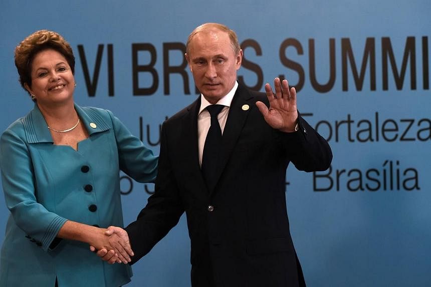 Brazilian President Dilma Rousseff (left) welcomes Russian President Vladimir Putin to the 6th BRICS summit in Fortaleza, Brazil. The BRICS abstained from criticising Russia over the Ukraine crisis, instead calling for restraint by all involved and a