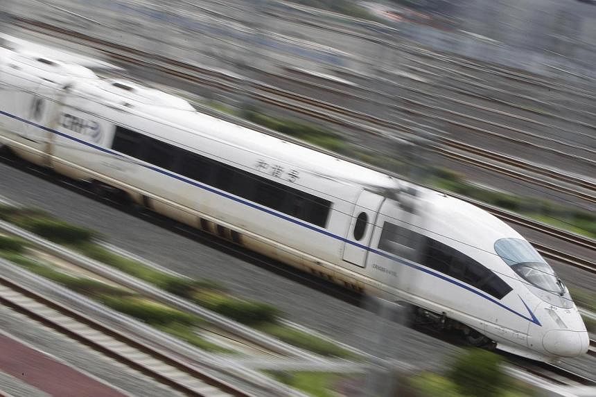 A CRH380BL high-speed bullet train runs towards Beijing South Railway Station on July 25, 2011.&nbsp;China has started selling naming rights for its bullet trains to commercial sponsors, state media reported Wednesday, July 16, 2014, as it increasing