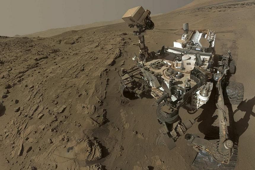 NASA's Mars Curiosity rover is pictured in this self-portrait where the rover drilled into a sandstone target called "Windjana" on Mars in this undated handout photo.&nbsp;The United Arab Emirates said on Wednesday, July 16, 2014, it planned to send 
