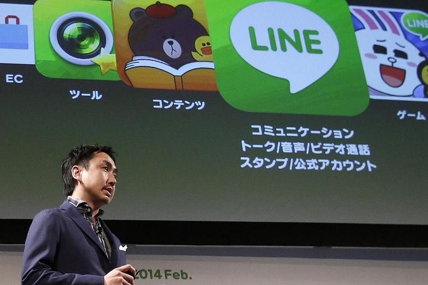 Takeshi Idezawa, chief operating officer of Line Corp, speaks during an announcement of its new service in Tokyo in this Feb 26, 2014 file photo.&nbsp;South Korea's Naver Corp said on Wednesday its Japan-based messaging application subsidiary Line Co