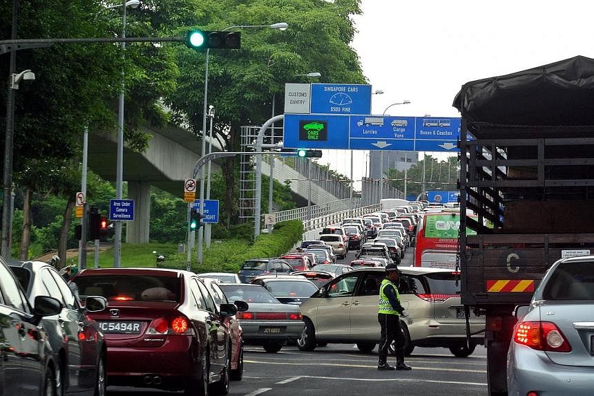 The massive traffic jam heading towards Johor Baru along Woodlands Causeway as seen on June 27, 2014.&nbsp;Malaysian Prime Minister Najib Razak has announced that the government has decided to implement the Vehicle Entry Permit fee for all foreign ve