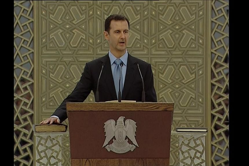 A still image taken from video shows Syria's President Bashar al-Assad speaking as he is sworn in for a new seven-year term at the presidential palace in Damascus on July 16, 2014. -- PHOTO: REUTERS