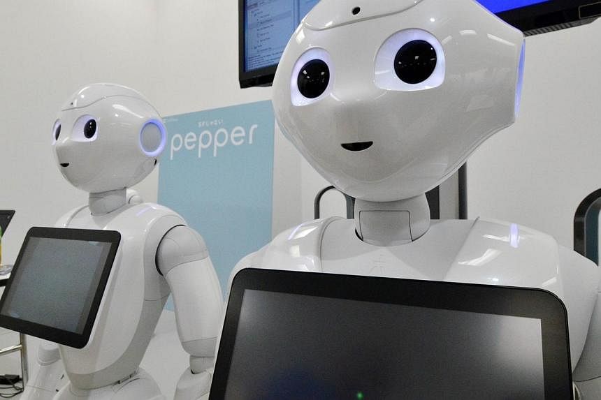 This picture taken on June 28, 2014 shows Japanese mobile communication giant Softbank's humanoid robot "Pepper" displayed at a high-tech gadgets exhibition in Tokyo.&nbsp;A wise-cracking humanoid robot unveiled in Tokyo last month is said to be able