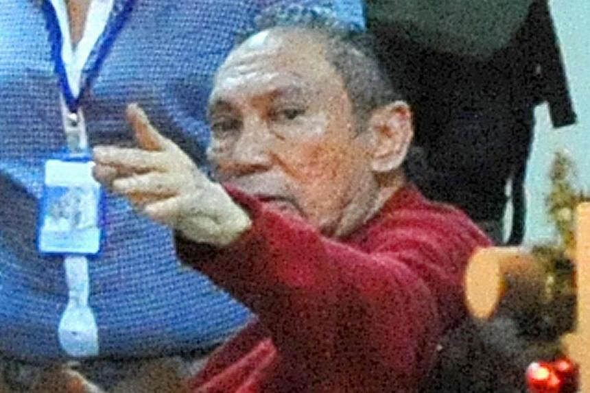 File picture taken on 2011 shows former Panamenian dictator Manuel Noriega gesturing upon arrival at the Renacer prison, 25 km south east of Panama City on Dec 11, 2011. -- PHOTO: AFP