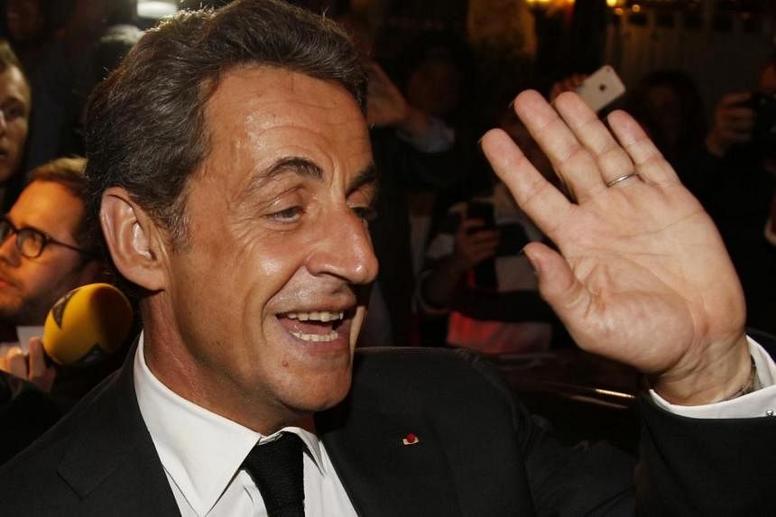&nbsp;Former French President Nicolas Sarkozy is seen here leaving a restaurant in Paris July 2, 2014.&nbsp;A new poll has shown that a clear majority of French centre-right voters want the former leader to seek re-election in 2017. -- PHOTO: Reuters