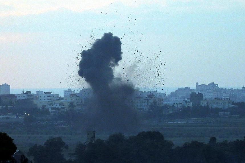 Smoke rises after an explosion in the Gaza Strip on July 16, 2014.&nbsp;A five-hour humanitarian truce agreed by Israel and Hamas came into force on Thursday, hours after the Israeli military said it fought Palestinian gunmen who infiltrated from Gaz