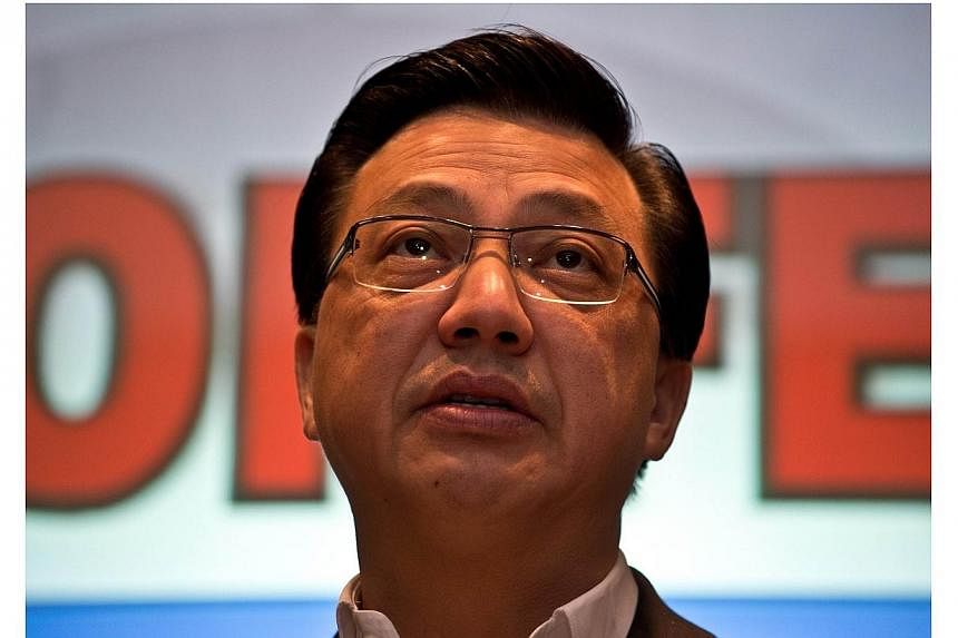 Malaysia's newly appointed Transport Minister Liow Tiong Lai addresses the media at a hotel near the Kuala Lumpur International Airport in Sepang on July 18, 2014. -- PHOTO: AFP