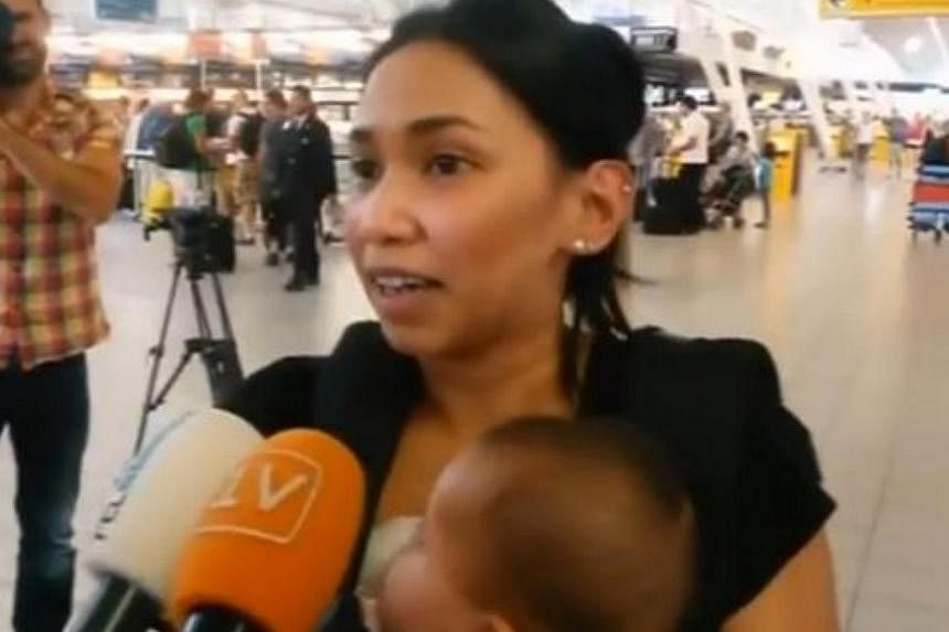 A Scottish couple had been planning to fly on Malaysia Airlines MH17 but switched to a later KLM flight because it was full. Mr Barry Sim and his wife Izzy (pictured), who heard about the tragedy on the way to the airport, spoke of the "sick feeling"