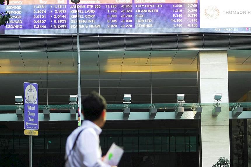 The Singapore stock market was 0.3 per cent weaker at 3,296.82 points in mid-morning trading. -- PHOTO: ST FILE