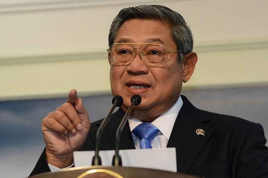 Indonesian President Susilo Bambang Yudhoyono gestures as he delivered his statement on the Malaysia Airlines flight MH17 Boeing 777 shot down over Ukraine that killed 298 passengers, at the presidential palace in Jakarta on July 18, 2014.&nbsp;