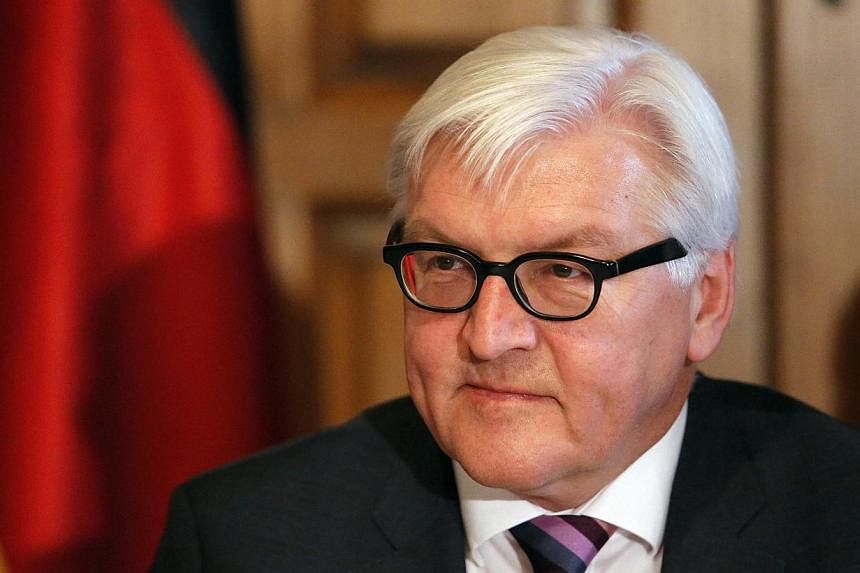 Foreign Minister Frank-Walter Steinmeier (above) and German Chancellor Angela Merkel&nbsp;have called for an independent, international investigation into the downing of a Malaysian airliner over eastern Ukraine. -- PHOTO: REUTERS