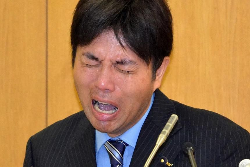 Japanese provincial politician Ryutaro Nonomura crying at a press conference to explain his profligate use of public funds at a prefectural office in Kobe in Hyogo prefecture, western Japan on July 1, 2014.&nbsp;The Japanese police on Friday, July 18