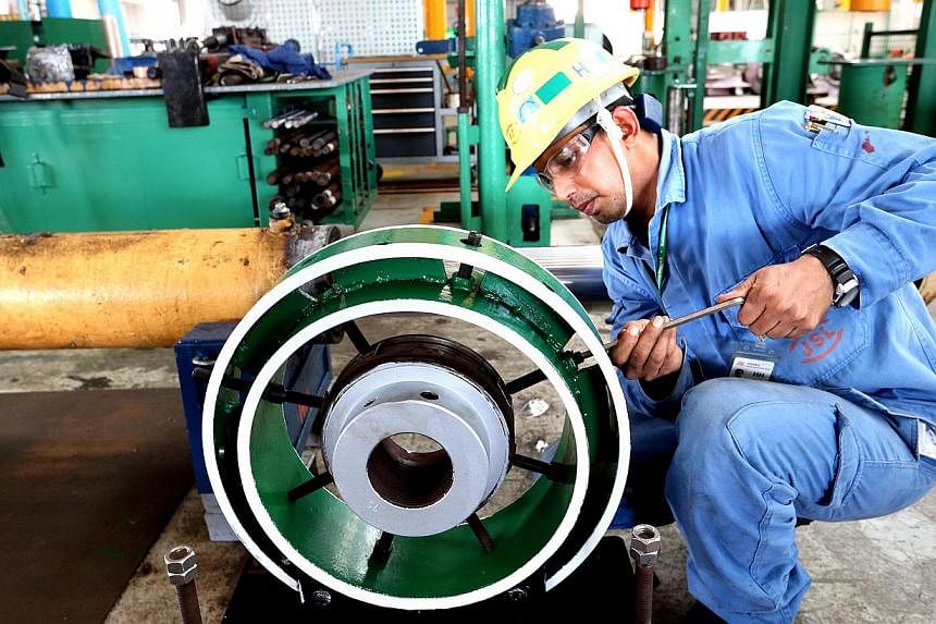 Assistant technical engineer Shamimul Islam Md Rezaul Karim working with a&nbsp;c-dile machine, which allows for safer maintenance on piston heads.&nbsp;The Manpower Ministry will review the existing Code of Practice on workplace safety and health ri