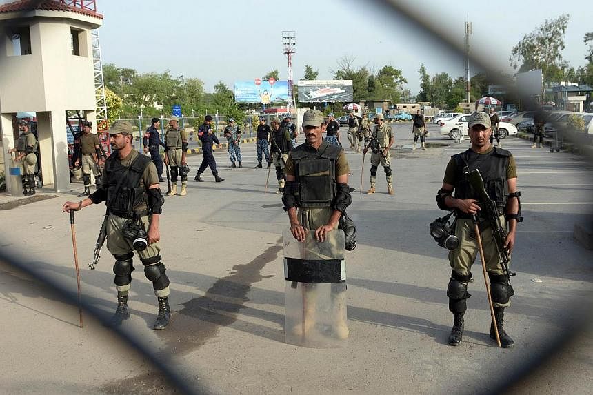 Pakistani Rangers stand guard at the Benazir Bhutto International Airport in Islamabad on June 23, 2014.&nbsp;A United States citizen was arrested at Islamabad airport on Friday, July 18, 2014 for attempting to board a plane carrying ammunition, Paki
