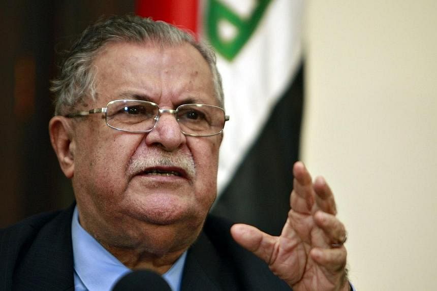 A file picture taken on March 02, 2009, shows Iraqi President Jalal Talabani speaking during a joint press conference in Baghdad. Mr Talabani flew back to his Kurdish fiefdom of Sulaimaniyah on Saturday, July 19, 2014, after more than 18 months in Ge