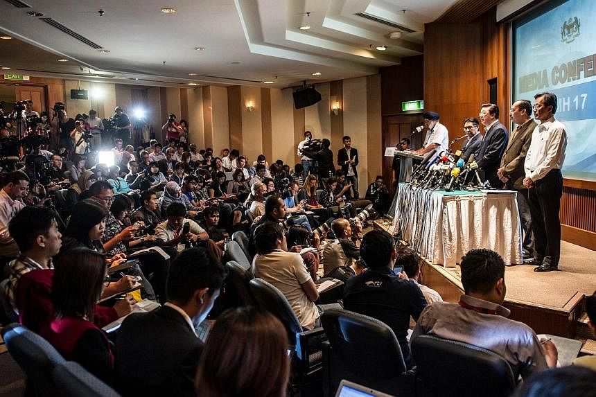 Malaysia's Transport Minister Liow Tiong Lai addresses the media at a hotel near the Kuala Lumpur International Airport in Sepang on July 19, 2014. Malaysia said vital evidence at the Ukrainian site where flight MH17 went down had been tampered with,
