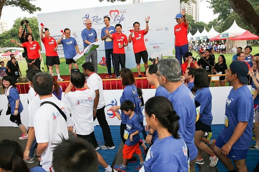More than 3,600 people ran for a cause on Saturday, July 19, 2014, morning, and raised $600,000 for a charity's programmes which benefit disadvantaged young people. -- ST PHOTO:&nbsp;ONG WEE JIN