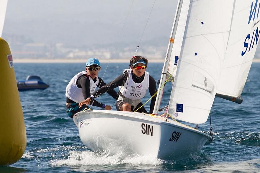 Singapore sailors Loh Jia Yi (left) and Jonathan Yeo were crowned world champions after winning the boys' 420 event at the Isaf Youth Sailing World Championships in Tavira, Portugal.&nbsp;-- PHOTO:&nbsp;NEUZA AIRES PEREIRA/ISAF YOUTH WORLDS