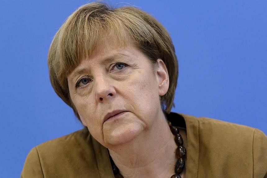 German chancellor Angela Merkel speaks during a press conference on July 18, 2014 at a press conference house in Berlin. -- PHOTO: AFP