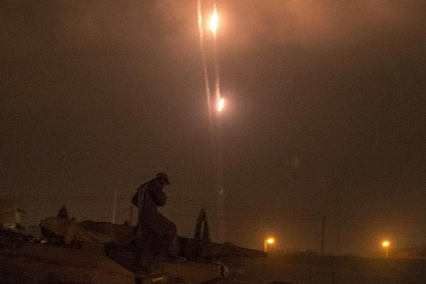 A picture taken from the southern Israeli-Gaza border shows rockets being fired from the Gaza Strip into Israel, on July 19, 2014.&nbsp;Israel fired shells into the Gaza Strip and militants kept up rocket fire into the Jewish state on Sunday with no 