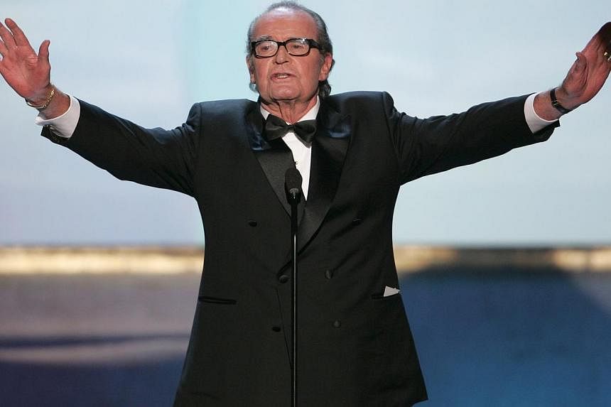 Actor James Garner holds out his arms at the 11th annual Screen Actors Guild awards at the Shrine Auditorium in Los Angeles on February 5, 2005.&nbsp;Actor James Garner, best known for his prime-time television roles as the wisecracking frontier gamb