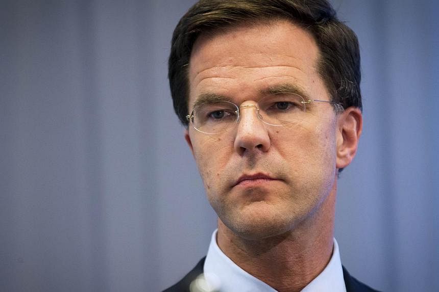 Dutch Prime Minister Mark Rutte gives a press conference at the Ministry of Safety and Justice in The Hague, on July 18, 2014, a day after an aircraft of Malaysia Airlines crashed in eastern Ukraine. Mr Rutte said on July 19, 2014, that&nbsp;Vladimir