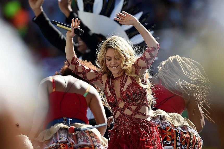Colombian singer Shakira performs during a closing ceremony ahead of the final football match between Germany and Argentina for the FIFA World Cup at The Maracana Stadium in Rio de Janeiro on July 13, 2014.&nbsp;Shakira has become the first person to