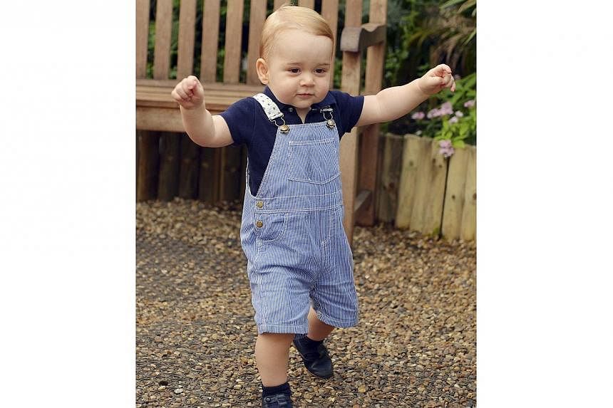 Britain's Prince George is seen ahead of his first birthday during a visit to the Sensational Butterflies exhibition at the Natural History Museum in London on July 2, 2014. -- PHOTO: REUTERS