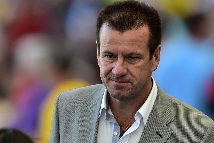 Rumours that Brazil will give former skipper Dunga (above) a second stint as national coach reached deafening levels on Sunday with Globo reporting he is about to be unveiled as Luiz Felipe Scolari’s successor. -- PHOTO: AFP