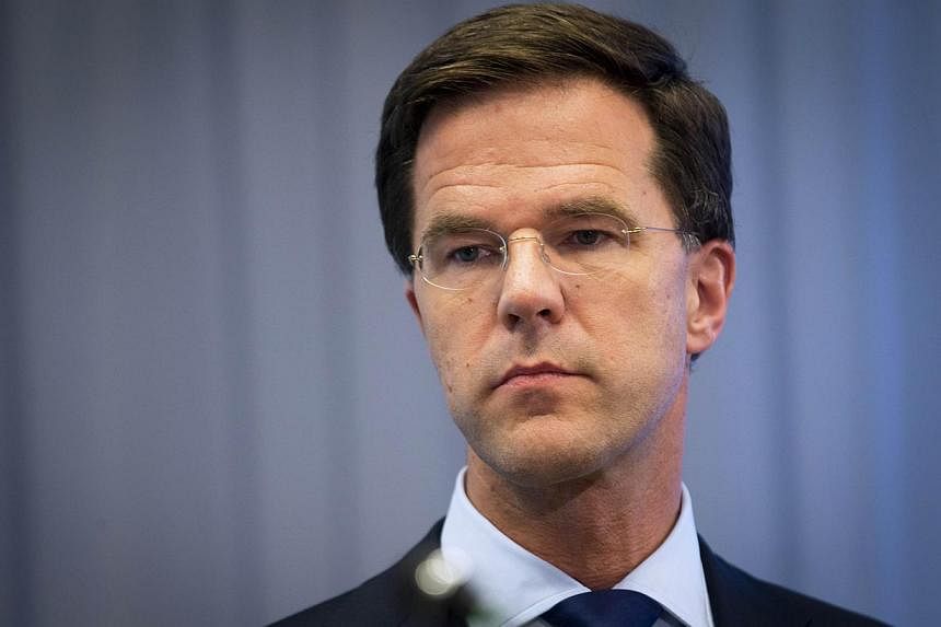 Dutch Prime Minister Mark Rutte gives a press conference at the Ministry of Safety and Justice in The Hague, on July 18, 2014, a day after an aircraft of Malaysia Airlines crashed in eastern Ukraine. -- PHOTO: AFP