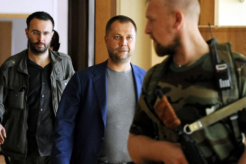 Self-proclaimed Prime Minister of the pro-Russian separatist "Donetsk People's Republic" Alexander Borodai walks to his press-conference Donetsk on July 18, 2014.&nbsp;-- PHOTO: AFP