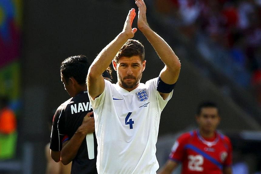 England's Steven Gerrard applauds at the end of their 2014 World Cup Group D soccer match against Costa Rica at the Mineirao stadium in Belo Horizonte on June 24, 2014.&nbsp;England captain Steven Gerrard announced his retirement from international f