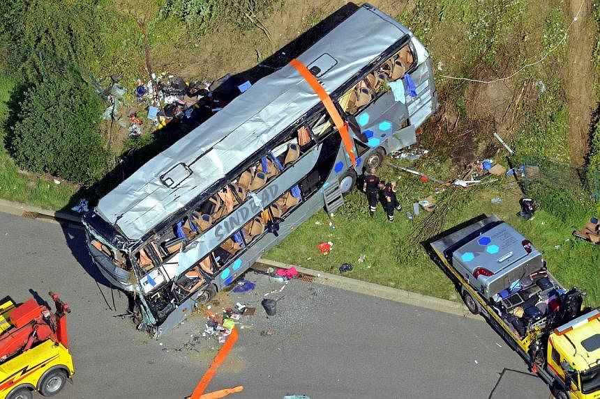Aerial view shows the accident site of a bus crash on the A4 motorway linking Poland and Germany near the Neustadt district in Dresden, eastern Germany, on July 19, 2014.&nbsp;The death toll from the crash climbed to 11 on Monday, July 21, after anot
