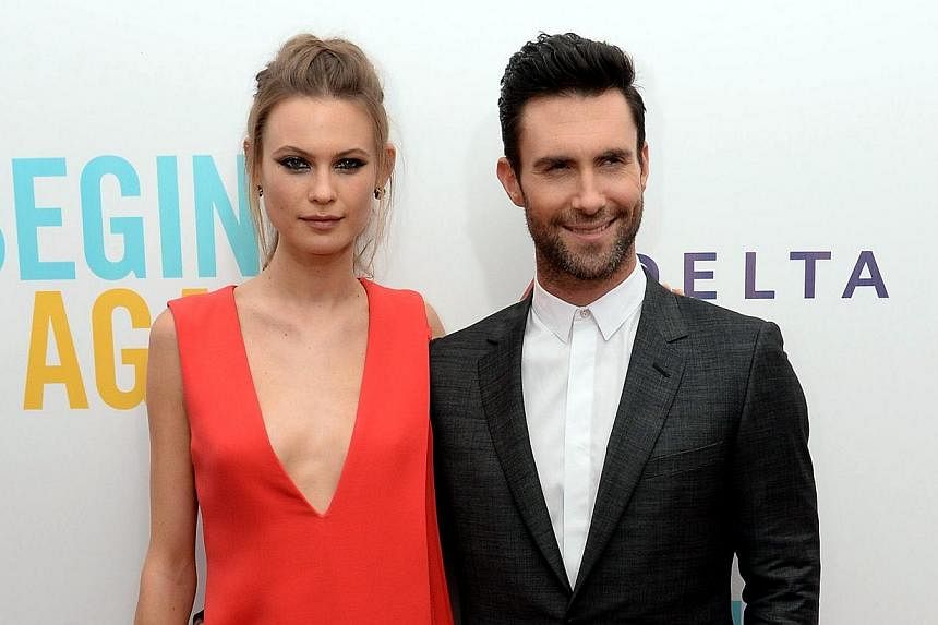 Model Behati Prinsloo and Adam Levine attend the Begin Again premiere at SVA Theater in New York City on June 25, 2014.&nbsp;-- PHOTO: AFP&nbsp;
