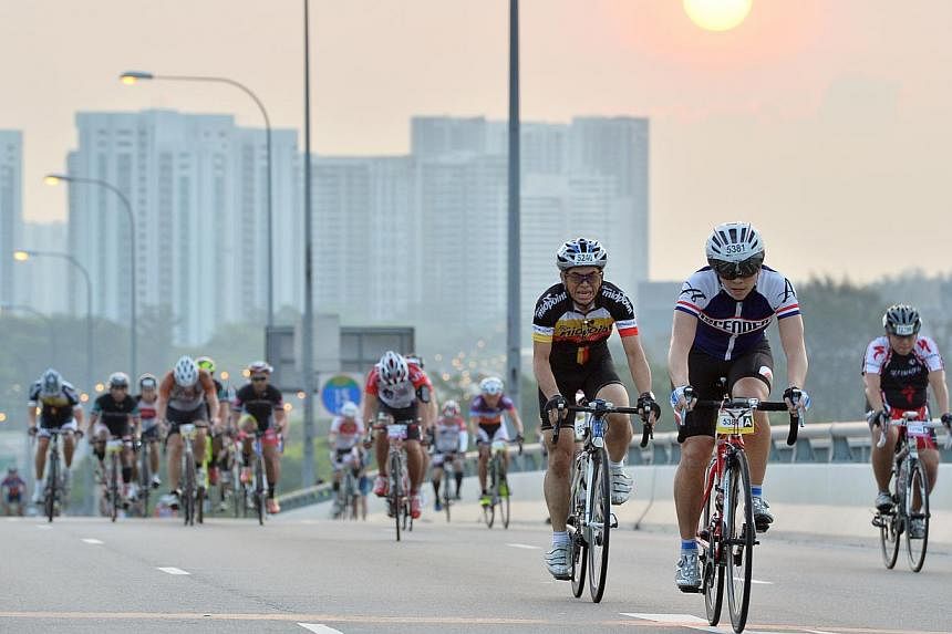 Cyclists cycling up Benjamin Sheares Bridge at the sixth edition of the OCBC Cycle Singapore at the F1 Pit Building on 30 March 2014. OCBC Bank is on the hunt for a new event organiser to run next year's OCBC Cycle in Singapore and Malaysia, in a bid