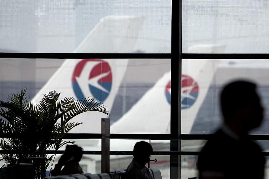 Airlines have been ordered to cut a quarter of their flights at a dozen Chinese airports to accommodate four weeks of "high frequency exercises" state media has reported. -- PHOTO: BLOOMBERG