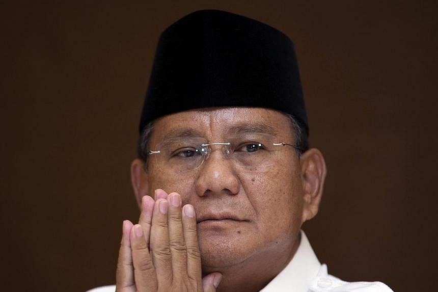 Indonesian presidential candidate Prabowo Subianto said Tuesday, July 22, 2014, he was withdrawing from the election process and would mount a legal challenge to the result, as his opponent Joko Widodo was poised to be declared the winner. -- PHOTO: 
