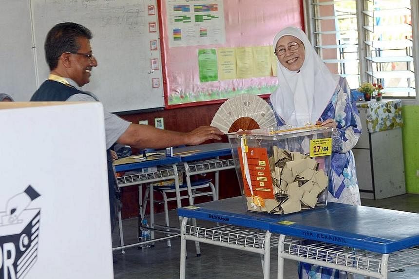 Dr Wan Azizah Ismail, president of Malaysia’s opposition Parti Keadilan Rakyat (PKR), won the Kajang state seat in a by-election on March 23, 2014.&nbsp;-- PHOTO:&nbsp;CHINA PRESS