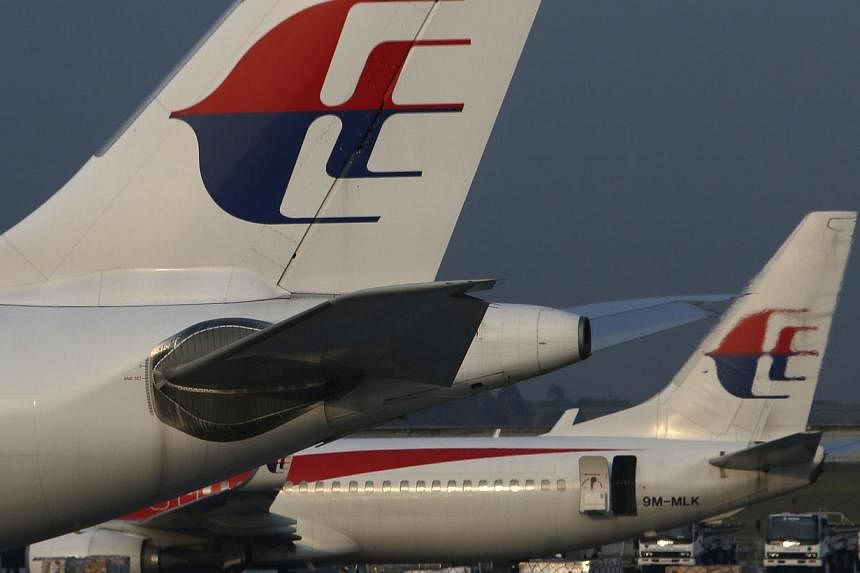 A plan to restructure Malaysia Airlines could be announced as early as the end of August, two sources with knowledge of the matter said, after one of its planes crashed in Ukraine in the second disaster to hit the carrier this year. -- PHOTO: REUTERS