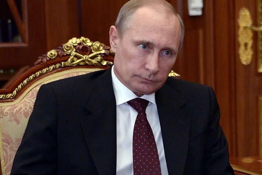 Russia's President Vladimir Putin attends a meeting in the Kremlin in Moscow, on July 7, 2014. -- PHOTO: AFP&nbsp;