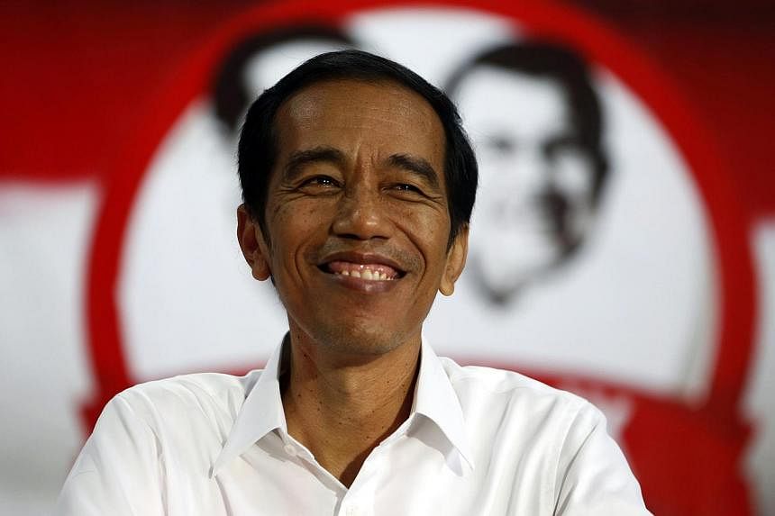 Jakarta governor Joko Widodo has won the Indonesian presidential election with 53 per cent of the vote against about 47 per cent for ex-general Prabowo Subianto, according to a tally of final results cited by local media on July 22, 2014. -- PHOTO: R