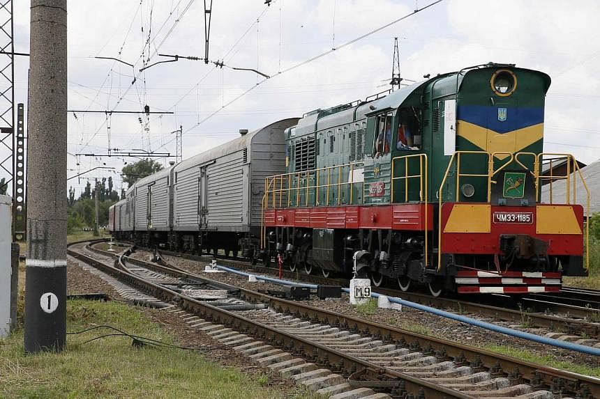 A train carrying the remains of the victims of Malaysia Airlines MH17 downed over rebel-held territory in eastern Ukraine arrives in the city of Kharkiv in eastern Ukraine on July 22, 2014.&nbsp;The first bodies from the MH17 crash in Ukraine will be