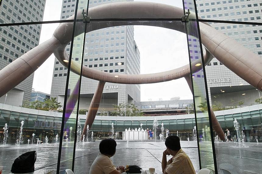 Suntec City's Fountain of Wealth seen from a new eatery after the first phase of the shopping mall's total facelift in September 2013. The completion of part of the mall's upgrading gave a boost to distributions at Suntec Real Estate Investment Trust