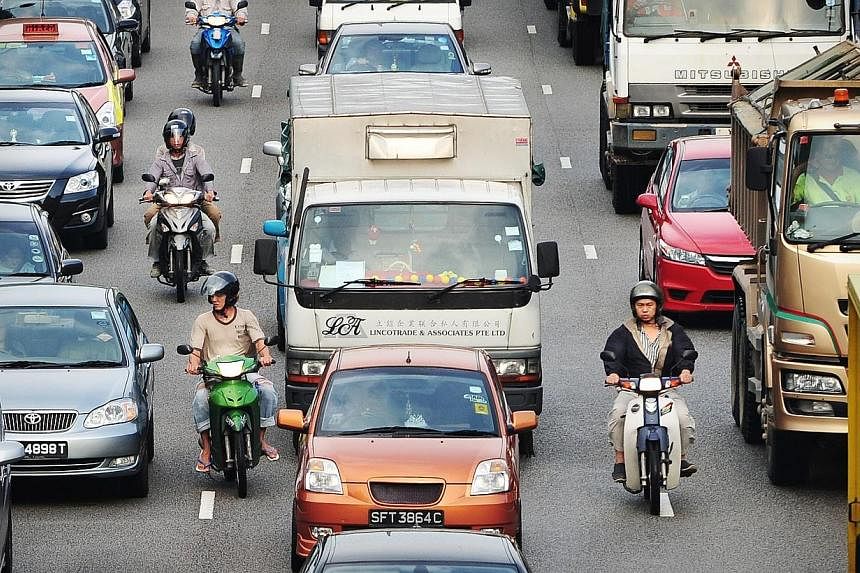 Certificate of entitlement (COE) prices ended higher across the board at the latest bidding exercise on Wednesday, July 23, 2014, with the commercial vehicle category registering the biggest increase. -- PHOTO: ST FILE