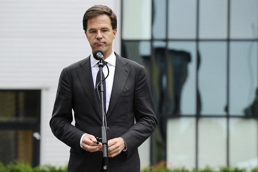 Dutch Prime minister Mark Rutte speaks after meeting relatives of victims of the Malaysia airlines plane crash in Utrecht on July 21, 2014. -- PHOTO: AFP&nbsp;