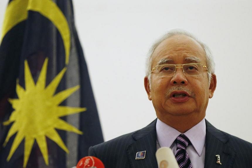 Malaysian Prime Minister Najib Razak speaks at a news conference where he announced that two black boxes from downed Malaysia Airlines flight MH17 will be handed over to Malaysia by Ukrainian rebels, in Kuala Lumpur on July 22, 2014. -- PHOTO: REUTER