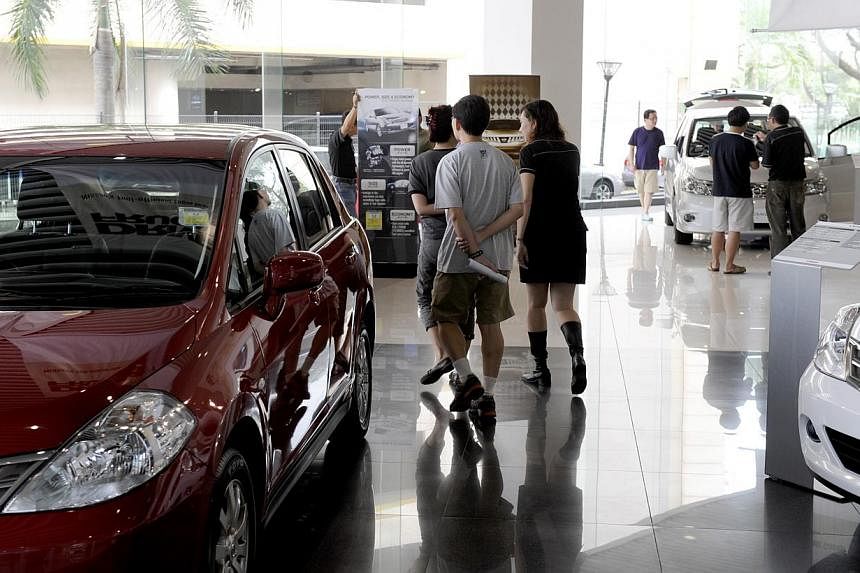 A smaller rise in car prices helped lower Singapore's inflation rate to 1.8 per cent last month from 2.7 per cent in May, data from the Singapore Department of Statistics showed on Wednesday. -- PHOTO: ST FILE