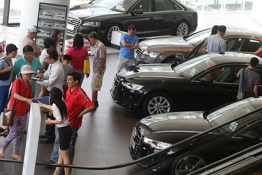 Potential car buyers at the Audi showroom at Alexandra Road in May 2014. -- PHOTO: ST FILE